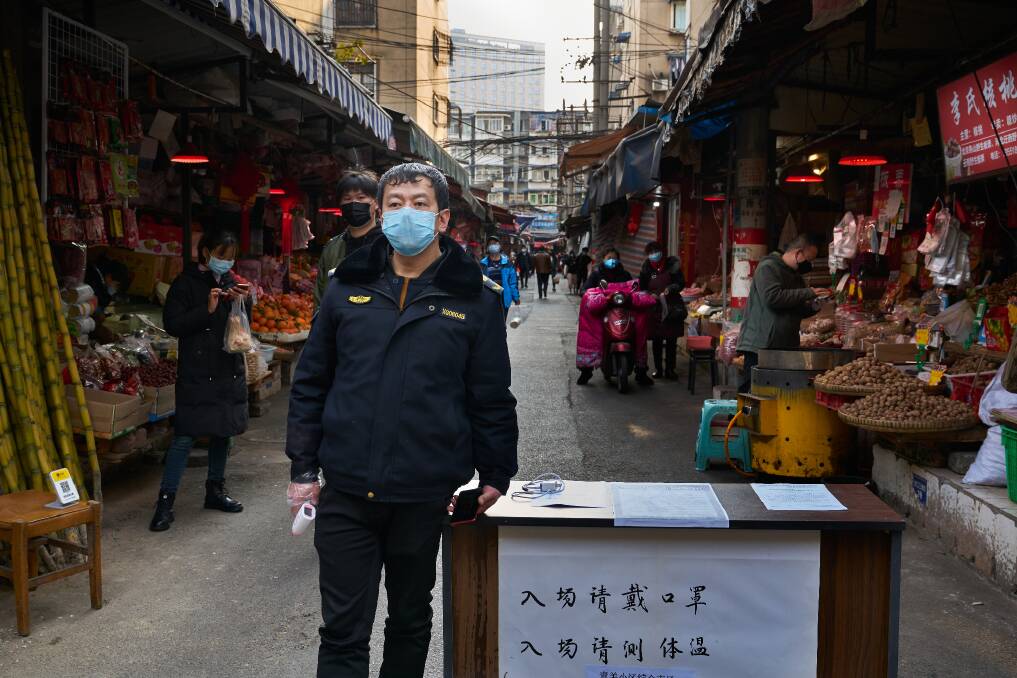 A Wuhan market security guard at the start of the pandemic. Picture: Shutterstock