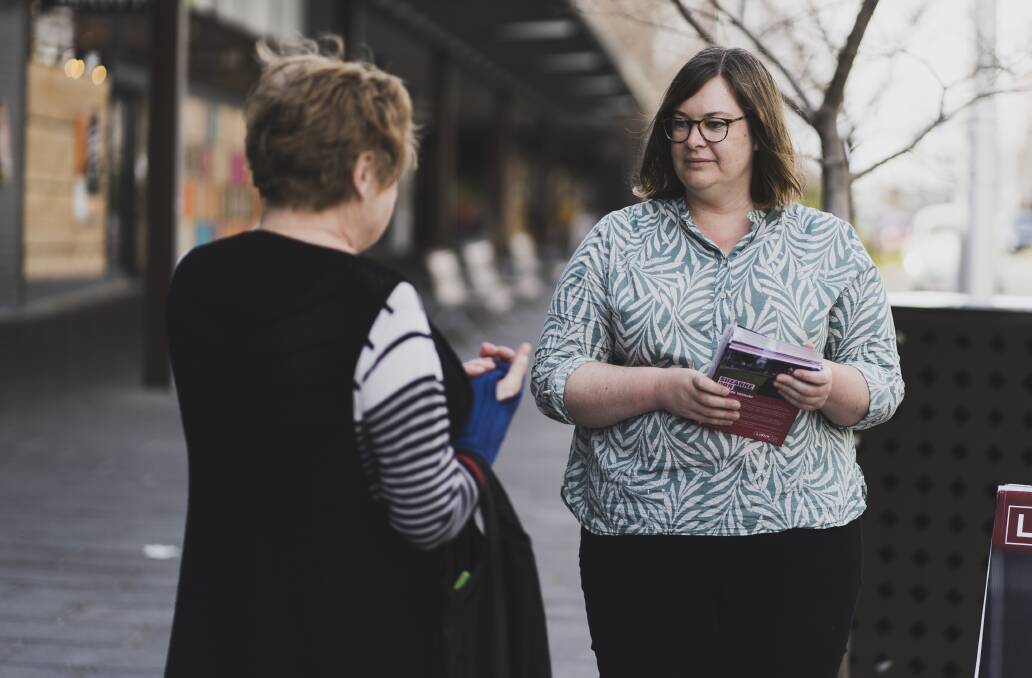 Labor's Suzanne Orr hands out pamphlets in Gungahlin on Saturday. Picture: Dion Georgopoulos