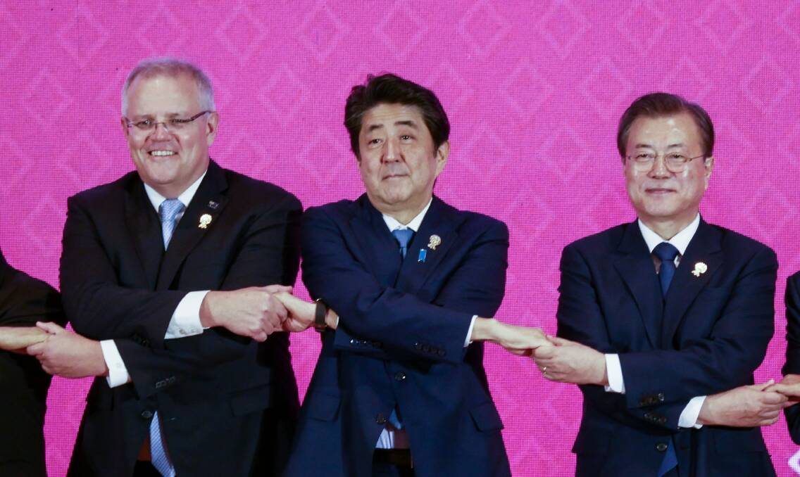 Australian PM Scott Morrison, former Japanese PM Shinzo Abe and Korean President Moon Jae-in at last year's RCEP summit in Thailand. Picture: Getty Images