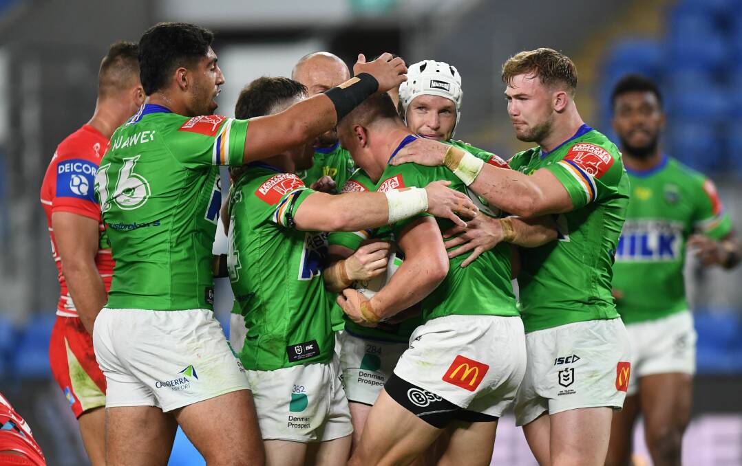 Raiders players celebrate a try against the Dragons. Picture: NRL Imagery