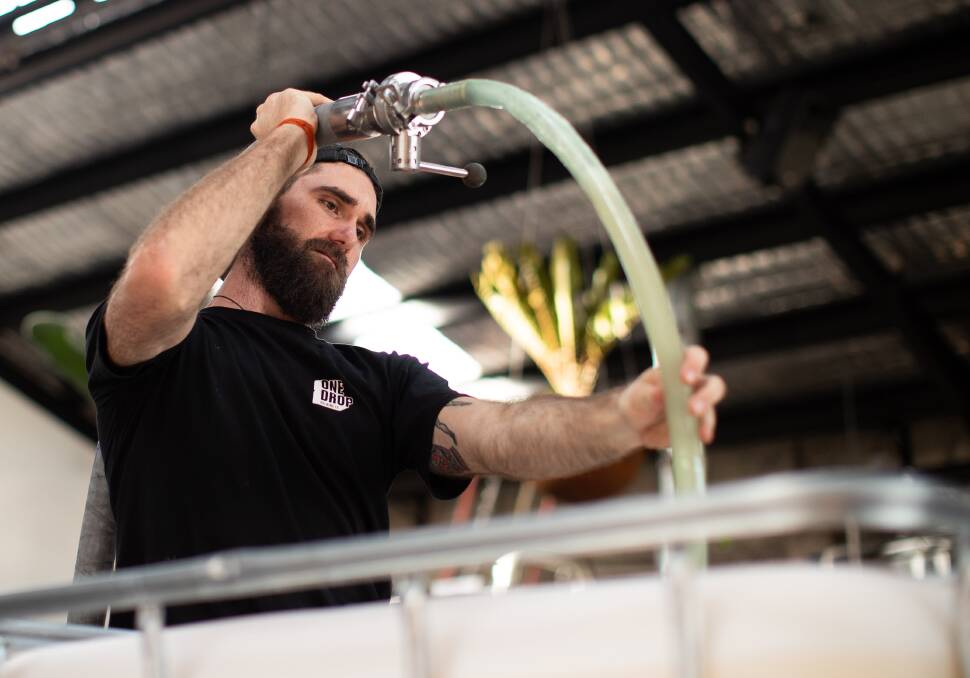 Nick Calder-Scholes, head brewer at One Drop Brewing in Sydney, converted to making hand sanitiser at the onset of the COVID-19 pandemic. Picture: Getty Images