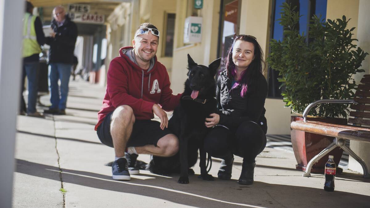 Canberra residents Ryan Zickefoose, Kayla Steele and their dog Bear in Braidwood on Thursday. Picture: Dion Georgopoulos