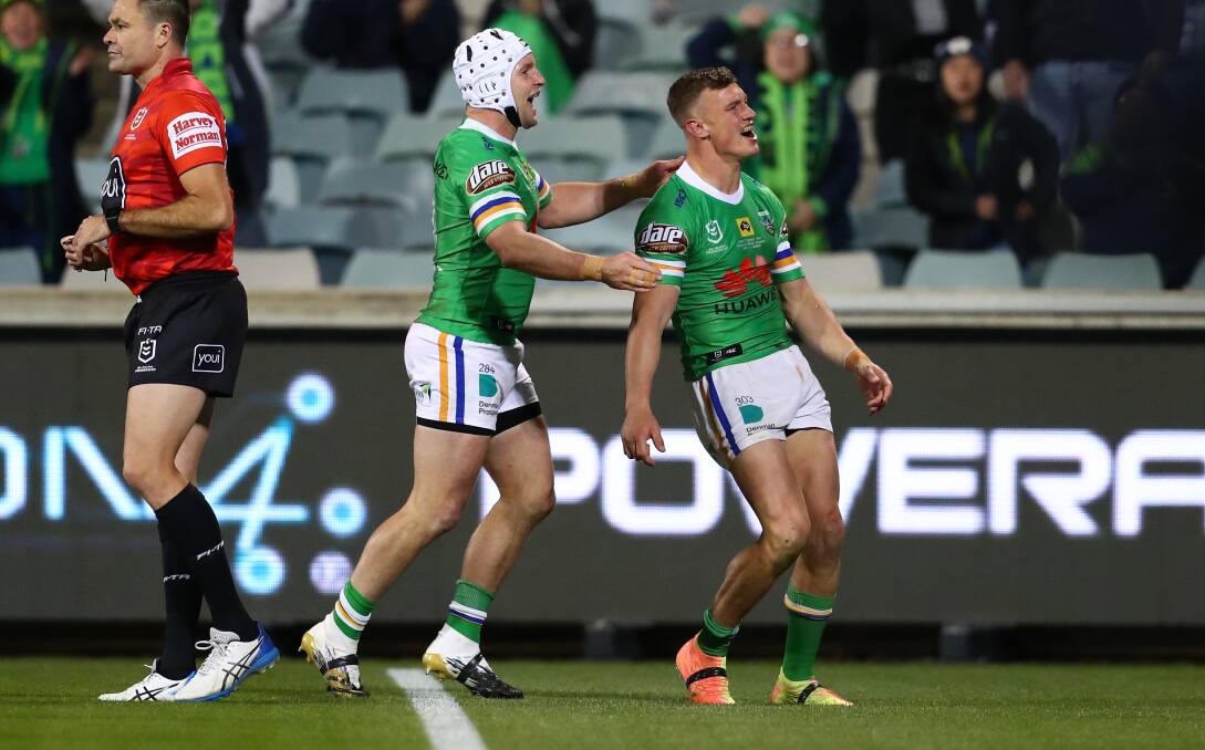 Jack Wighton is congratulated by Jarrod Croker after scoring one of his two tries last night. Picture: NRL Imagery