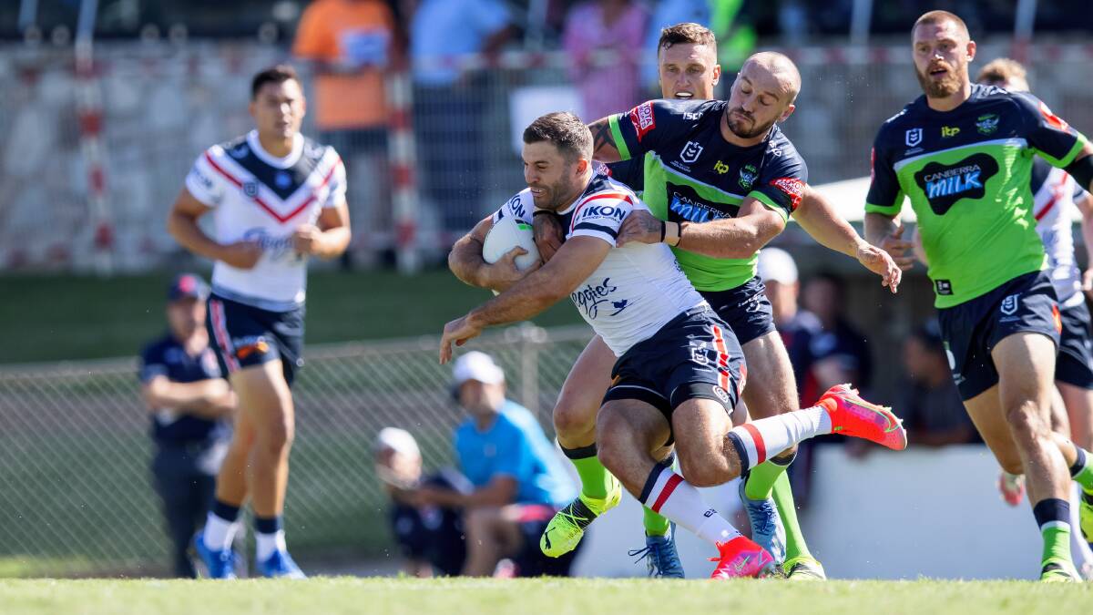Josh Hodgson wraps up Roosters fullback James Tedesco. Picture: Sitthixay Ditthavong