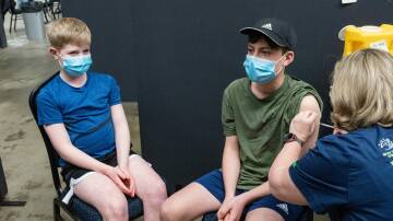 Joel and Luke Faulkner get COVID vaccinations in Launceston in 2021.
Picture by Phillip Biggs