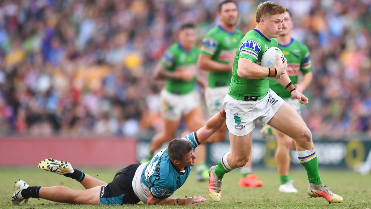 Zac Woolford makes a break to set up a decisive late Raiders try against the Sharks in his NRL debut on Sunday. Picture: Getty Images