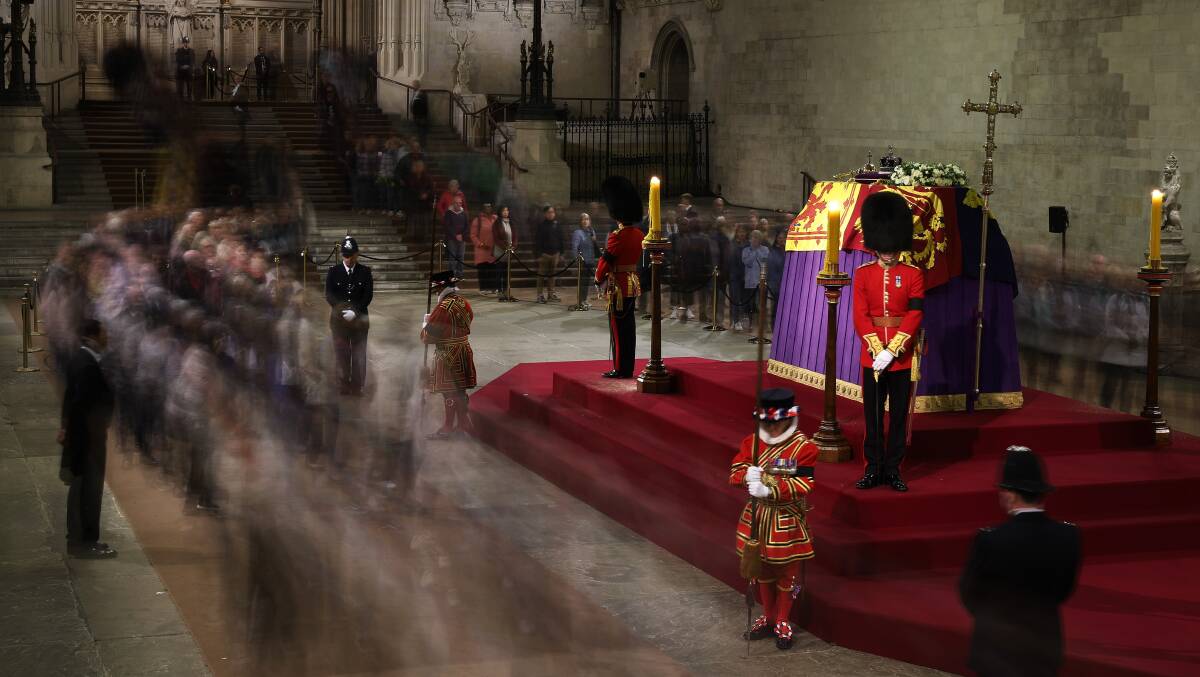 Members of the public lined up for hours to view Queen Elizabeth II's flag-draped casket at Westminster Hall. Picture Getty Images