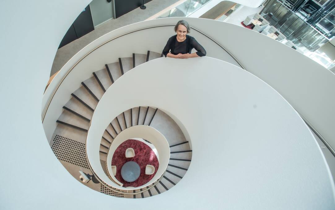 Catherine Townsend at the government building in Dickson, which features a striking spiral staircase as a centrepiece. Picture: Karleen Minney