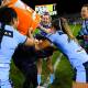Sam Bremner, centre, helps deliver the traditional post-match Gatorade shower to Sky Blues coach Kylie Hilder on Friday. Picture: AAP