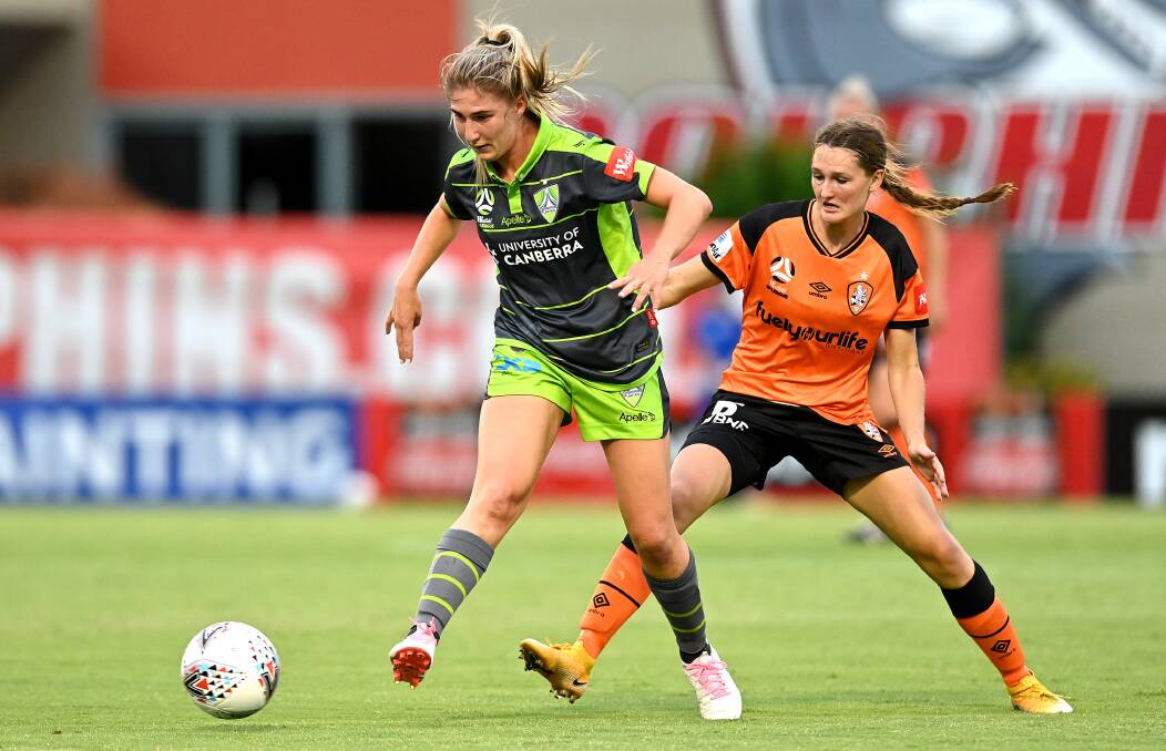 Canberra United's Demi Koulizakis in action against the Roar in Brisbane on Thursday night. Pictured: Getty Images