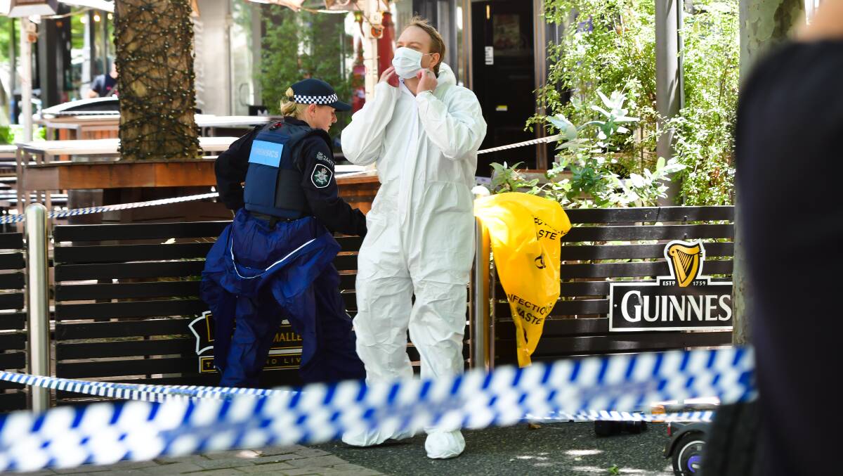 Police and forensic investigators at the scene of Saturday morning's stabbing in Civic. Pictures: Elesa Kurtz