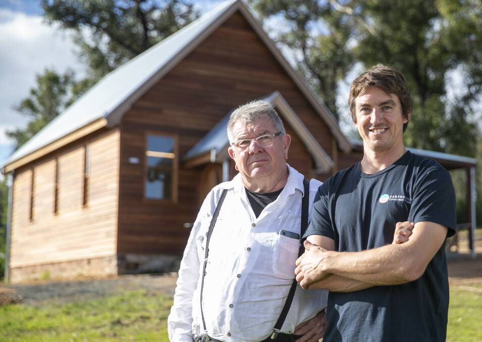 Builder Peter Jirgens, right, rebuilt the old Mogo church, a former home to Peter Williams' Mogo Pottery, thanks to the kindness of community and global donations after the devastating New Year's Eve bushfire of 2019. Picture: Keegan Carroll