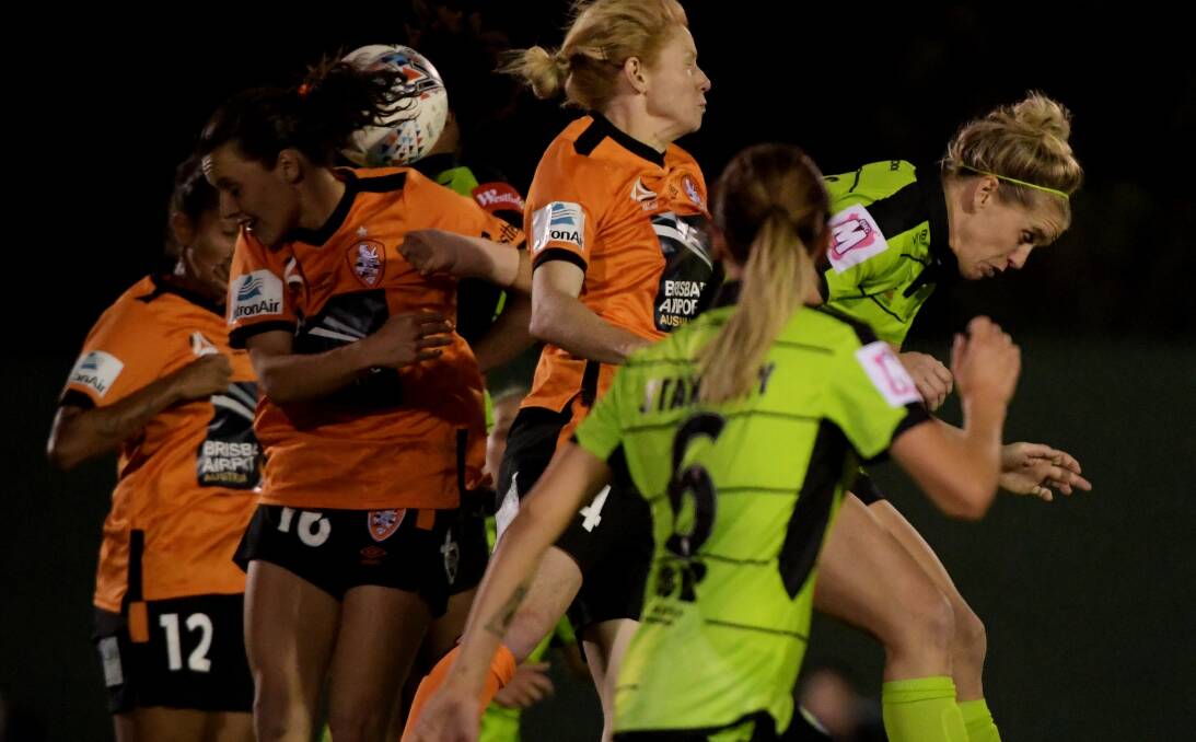 Canberra United and Brisbane players contest a corner on Thursday night. Picture: Getty Images