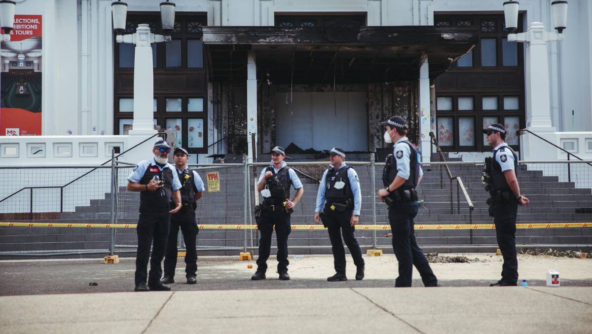 Police patrol the vicinity the day after violent protests and a fire broke out at Old Parliament House. Picture: Dion Georgopoulos