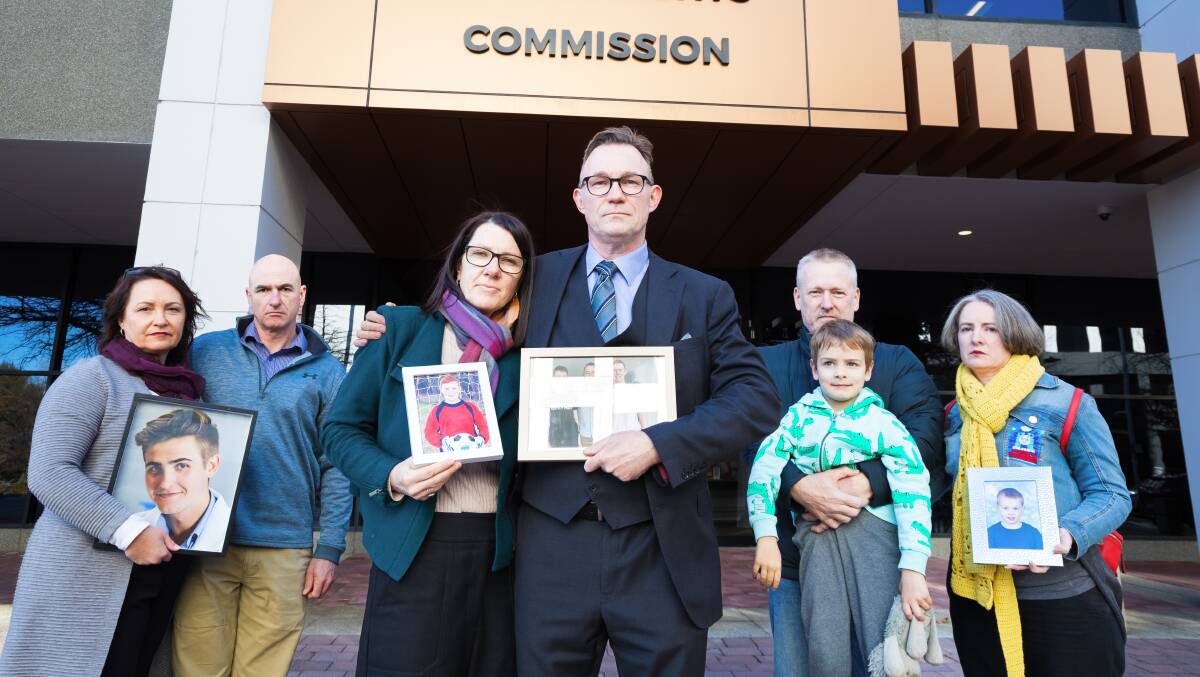 Families of road accident victims gather before a meeting with ACT Attorney-General Shane Rattenbury on Friday. Left to right: Janice and Garry Seary; Sarah Payne and Tom McLuckie; and Andrew Corney, Aidan Corney, 6, and Camille Jago. Picture: Sitthixay Ditthavong