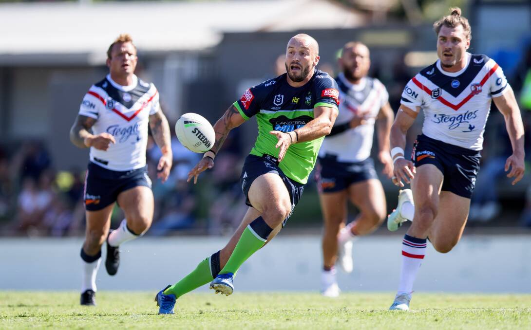 Josh Hodgson finds a pacier Raiders option after making a break against the Roosters. Picture: Sitthixay Ditthavong