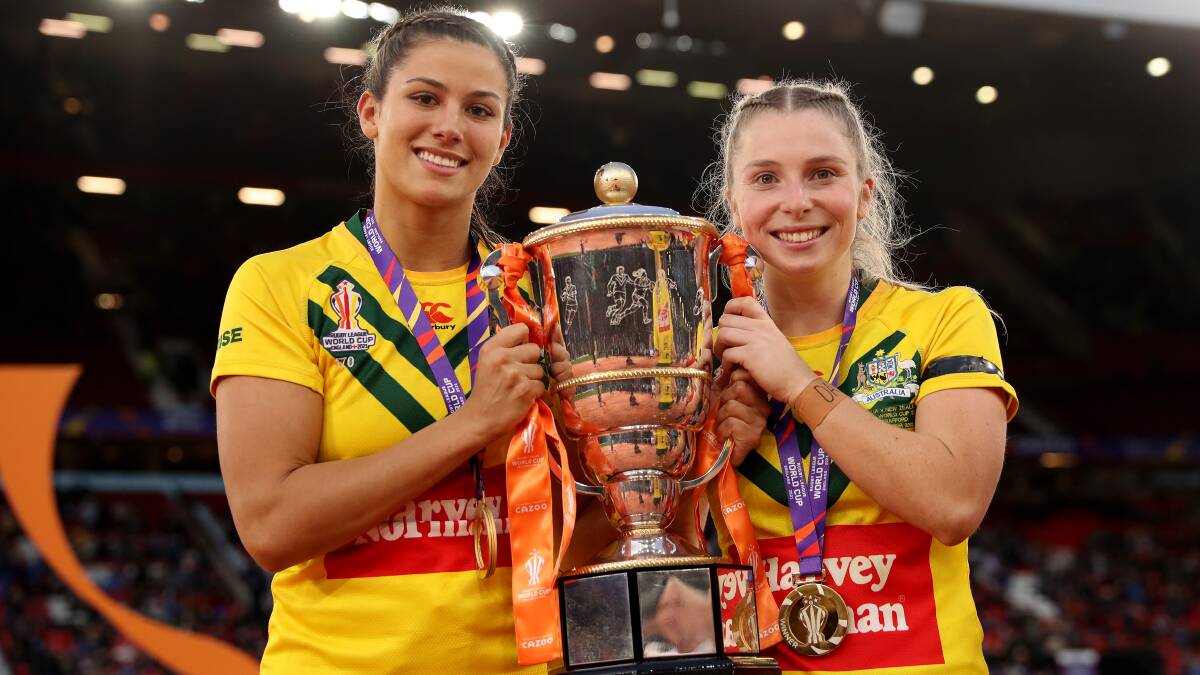 Shaylee Bent, left, pictured with Tarryn Aiken, helped the Australian Jillaroos win the Women's Rugby League World Cup last month. Bent is the partner of David Fifita and could join the Titans forward in Canberra as part of a package deal to become a marquee recruit for the Raiders' new NRLW side. Picture Getty Images