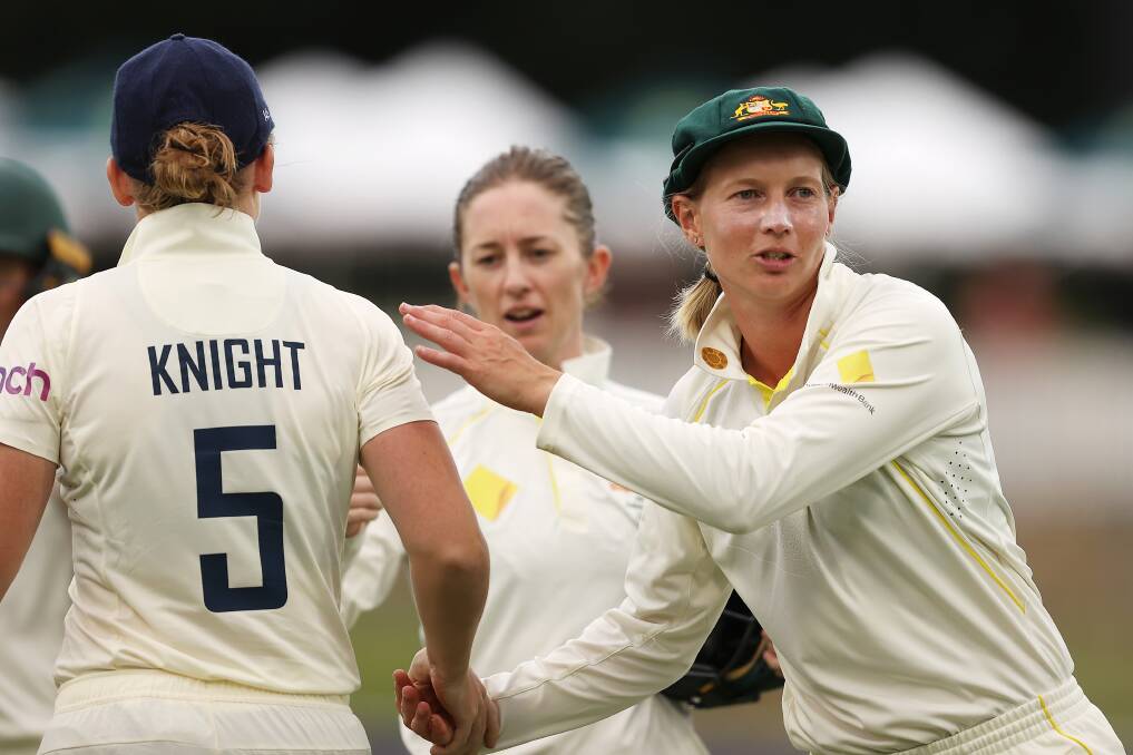 Skippers Heather Knight and Meg Lanning shake hands afterwards at Manuka Oval. Picture: Getty