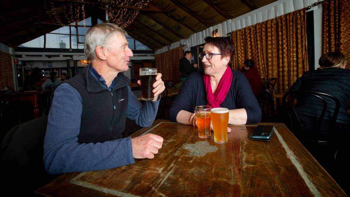 Rod Taylor and Frieda Schimmelpfennig at The Old Canberra Inn, which is the drinking spot of choice for some in Canberra's hard of hearing community. Picture: Elesa Kurtz