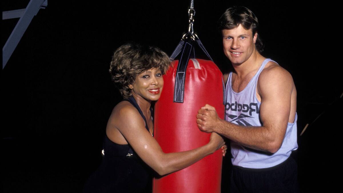 Tina Turner in 1993 with rugby league glamour boy Andrew Ettingshausen, who featured prominently in the NSWRL's iconic 'Simply The Best' advertising campaign. Picture Getty Images