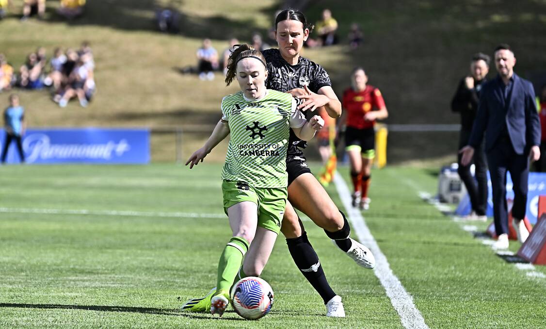 Canberra United's Sasha Grove and Wellington's Zoe McMeeken vie for possession. Picture Getty Images