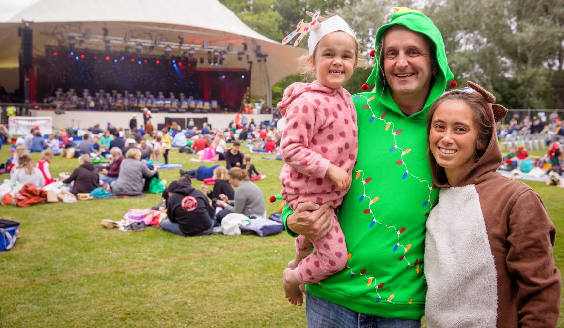 Jasmine, 3, Justin, and Jenny Watson from Kaleen were ready for a festive night of carols. Picture: Sitthixay Ditthavong