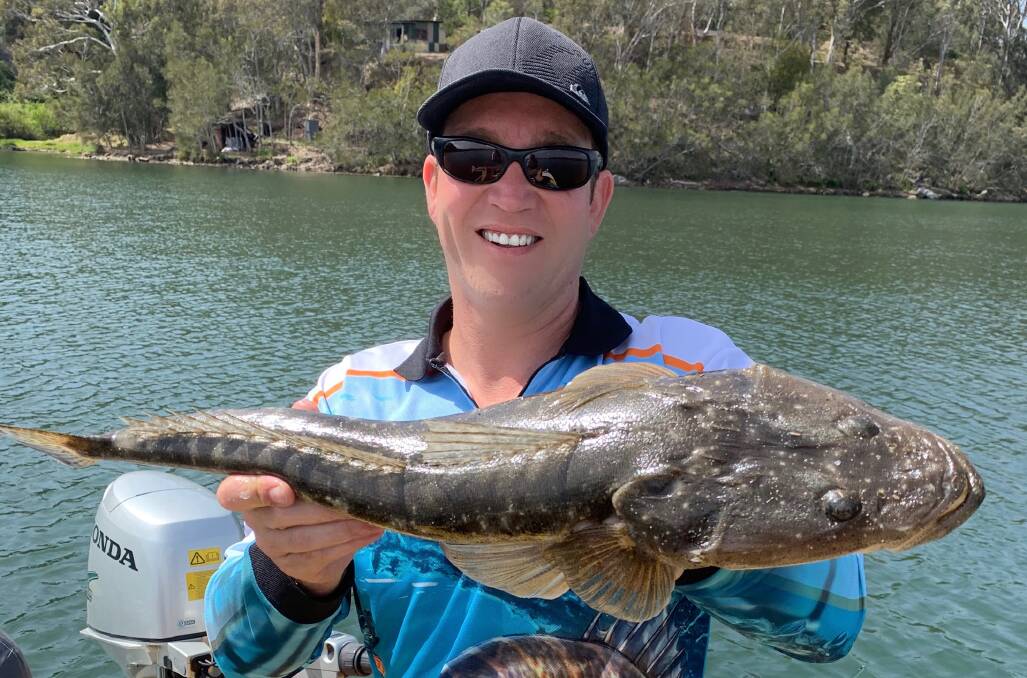 Ash Leggott with a solid Tuross flathead lured from five metres of water in front of the Tuross Boatshed.