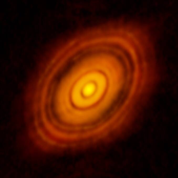 An image of HL Tau. The bright rings are where there is lots of dust and gas and the dark rings could be where planets are carving out a gap. Picture: ALMA (ESO/NAOJ/NRAO); C Brogan, B Saxton (NRAO/AUI/NSF)