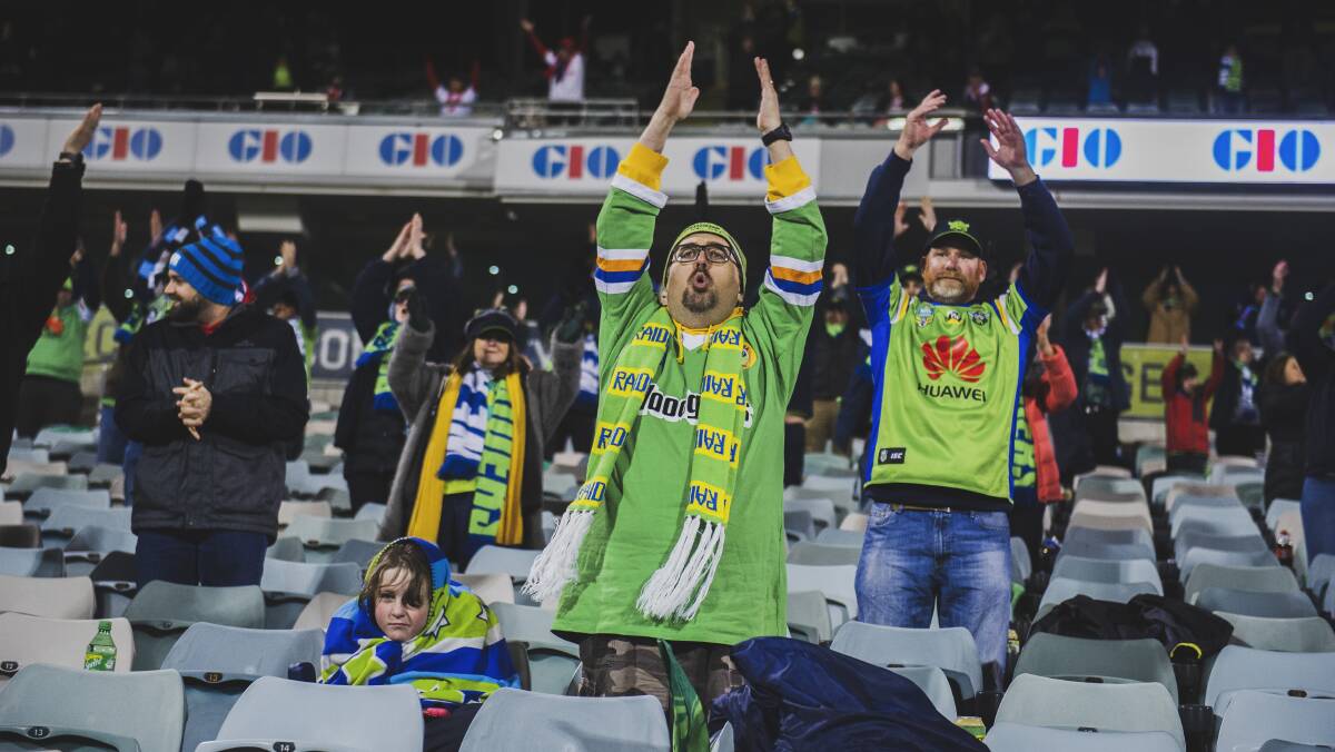 The Viking clap - social distance-style - tonight at Canberra Stadium. Picture: Dion Georgopoulos