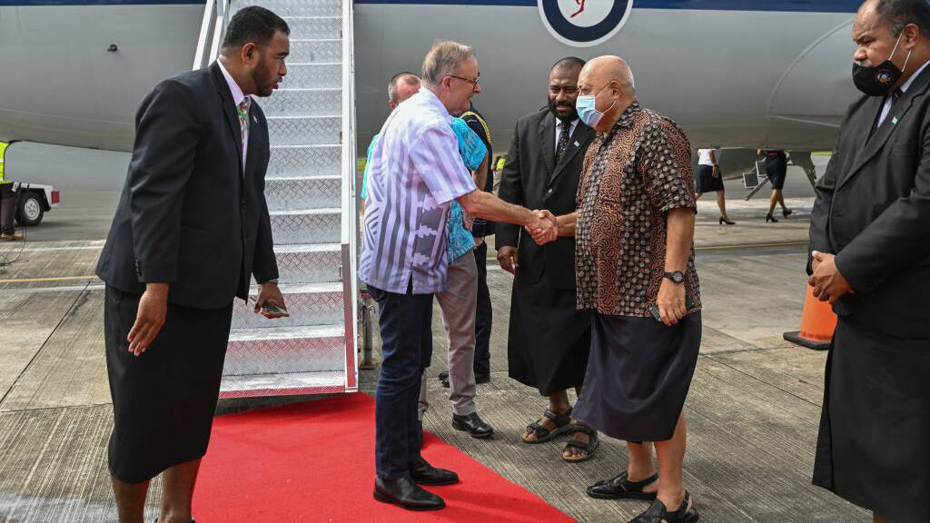 Australia Prime Minister Anthony Albanese greets dignitaries as he arrives at Nausori Airport on July 13, 2022 in Suva, Fij. Picture: Getty Images