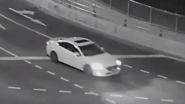 Police now want to speak to the occupants of a white two-door Lexus captured on video footage entering the Barton Highway from William Slim Drive in the ACT on the night of the shooting. Picture: NSW Police. 