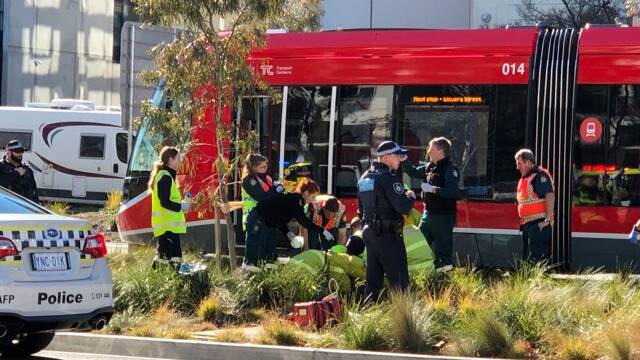 Emergency services are treating a person after they were hit by a light rail vehicle. Picture: John Mikita 
