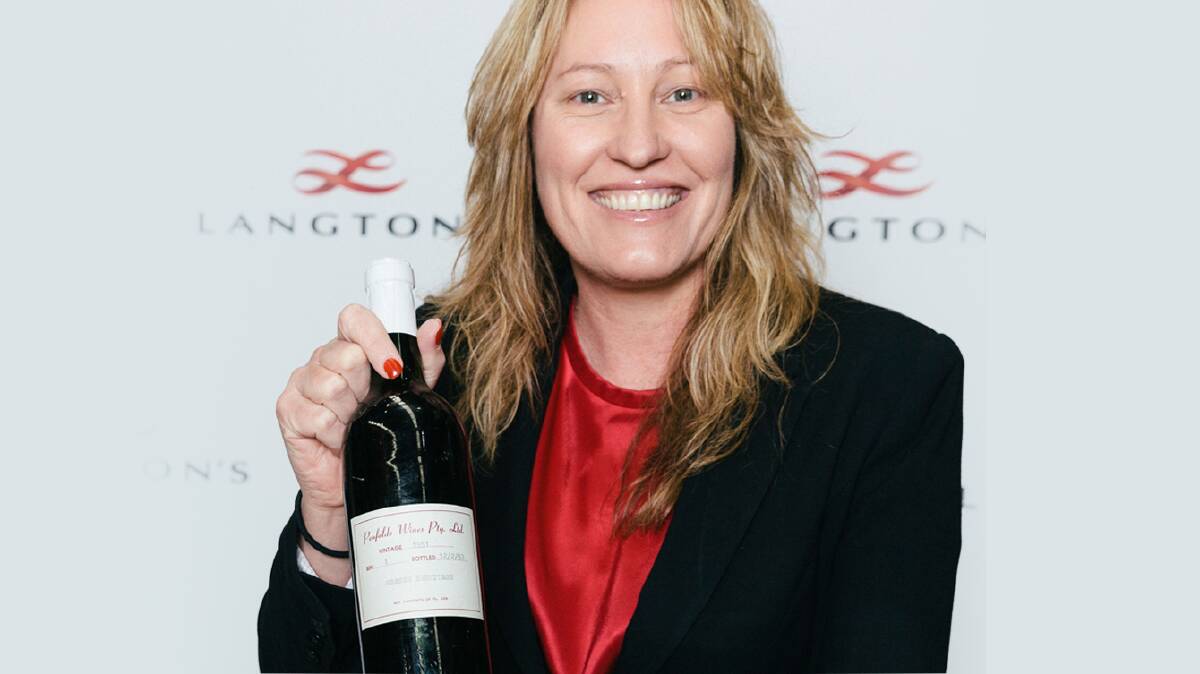 RECORD: Langton's head of auctions Tamara Grischy with the bottle of Penfolds 1951 Grange.