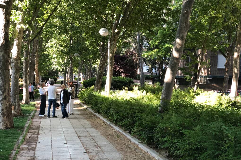 CHAT CENTRAL: Pocket parks provide friendly gathering spaces in Madrid's suburbs.