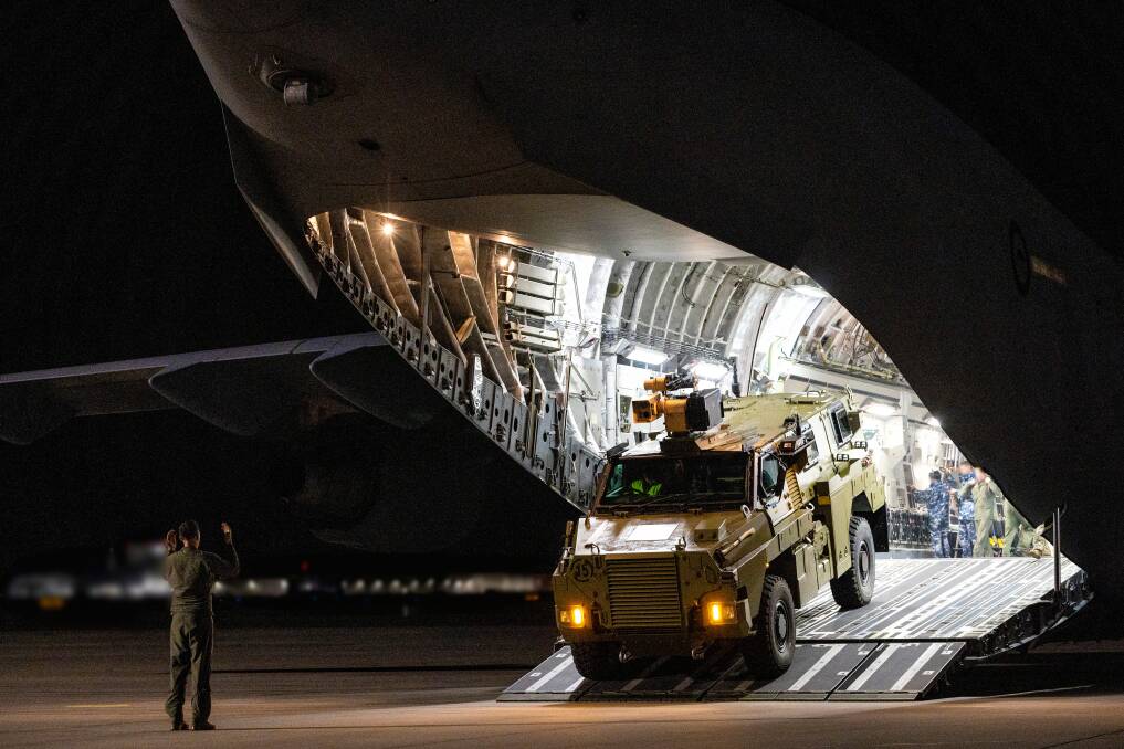 A Bushmaster bound for Ukraine is unloaded at a secret Europe location. Picture supplied by the Australian Defence Force/Jake Badior