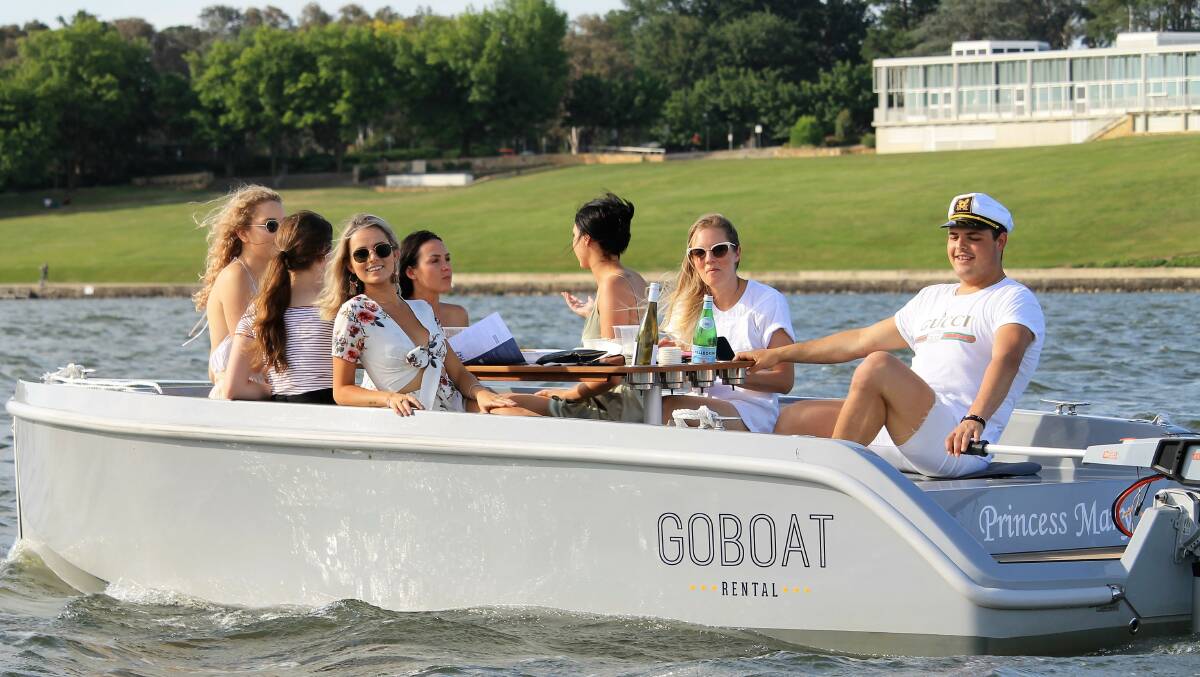 DAY ON THE LAKE: A group of friends soak up the sunshine with a day of boating on Lake Burley Griffin. Photo: GoBoats.