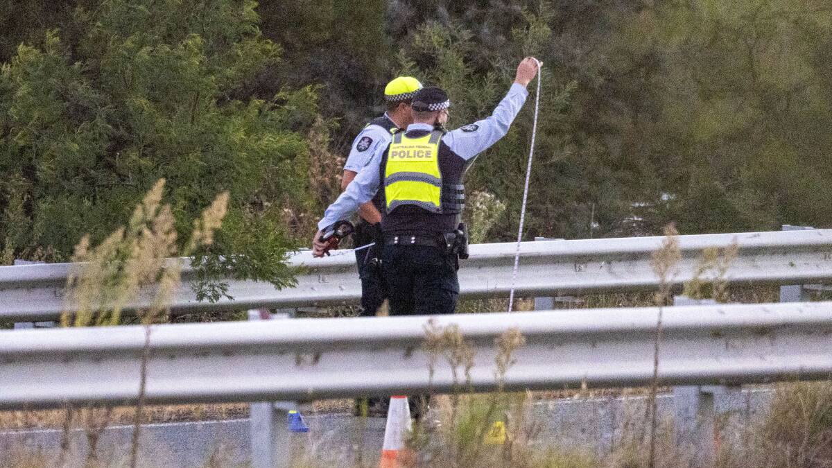 The police collision investigation team inspects the site of the crash. Picture Canberra Times