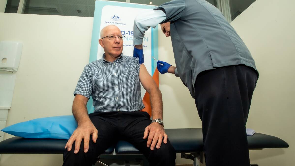 The Governor-General receives his first round of the Australian-produced AstraZeneca vaccine, administered by Dr John Howe. Picture: Karleen Minney.