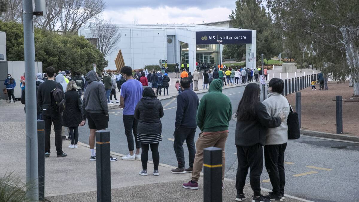 Canberrans stuck in long queues after a system glitch led to vaccine appointments being overbooked. Picture: Keegan Carroll