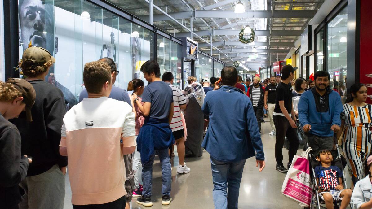 People queued to enter stores for Boxing Day sales, irrespective of the current pandemic. Picture: Elesa Kurtz