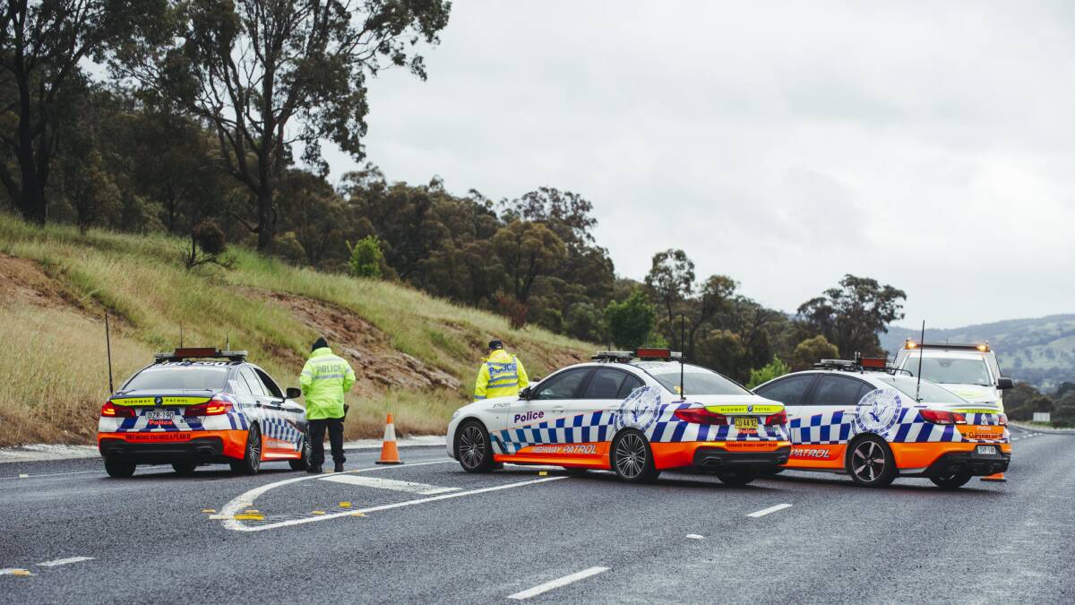 Police block vehicles from entering an area where a fatal crash occurred on the Monaro Highway. Picture: Dion Georgopoulos
