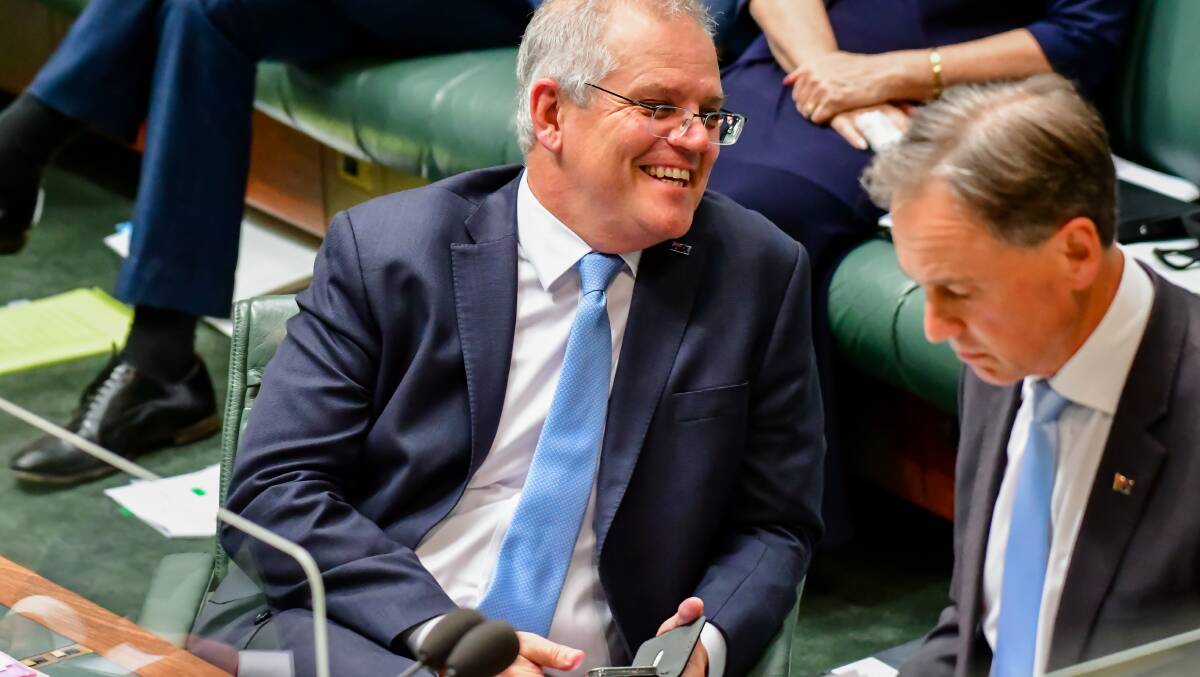 Scott Morrison's act works brilliantly when he's on stage or at a photo opp, but you won't catch him actually holding a hose. Picture: Elesa Kurtz