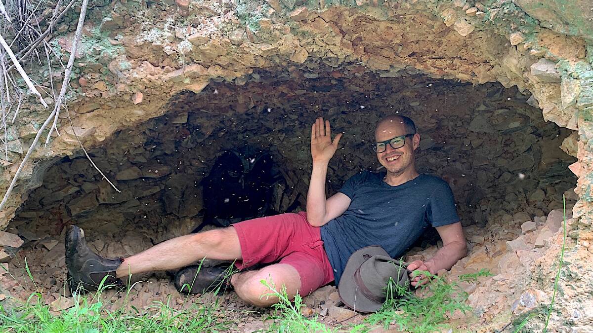 Dan Gordon joins hundreds of insects in a fanglomerate 'cave' near the Botanic Gardens. Picture: Tim the Yowie Man