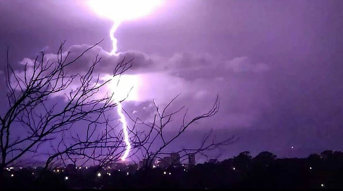 Lightning cracked down over the capital overnight, with Gungahlin's sky lighting up above the marketplace at 1.17am. Picture: Southern Property Canberra