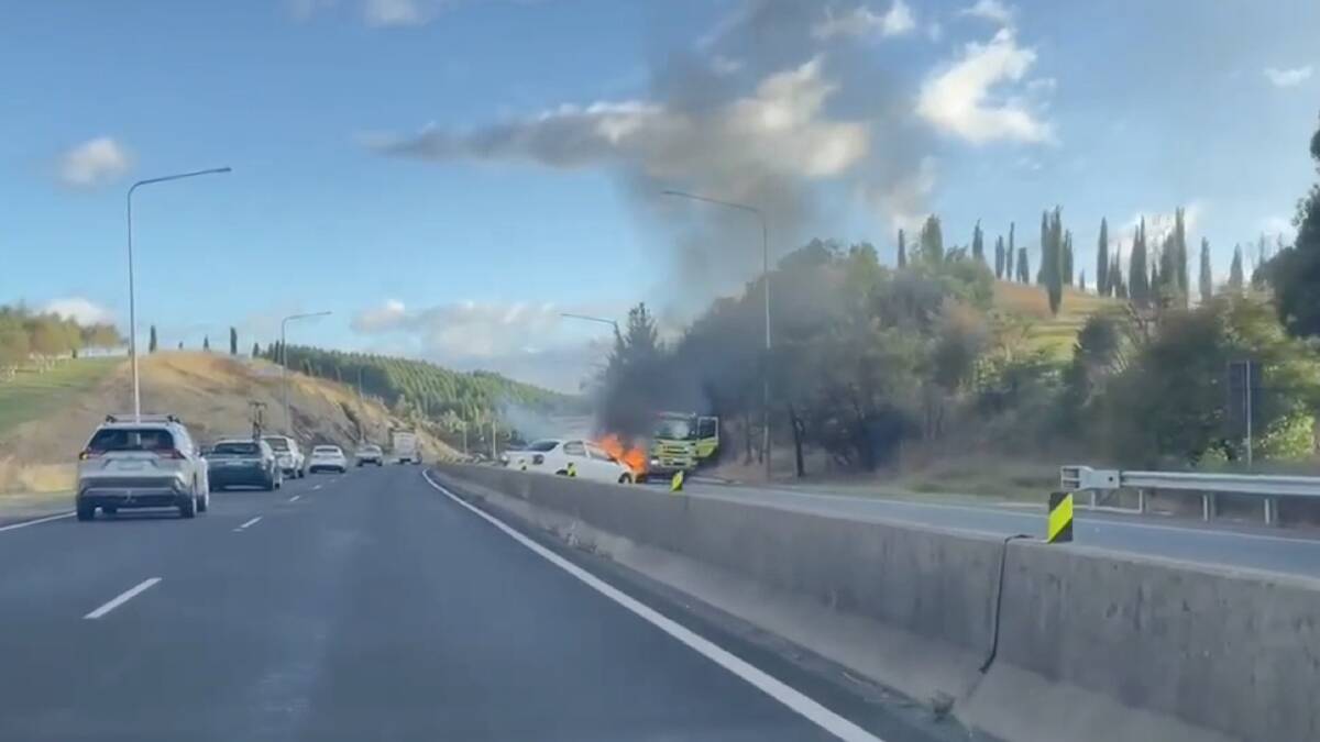 Emergency services attend to a car fire on the Tuggeranong Parkway. Picture supplied