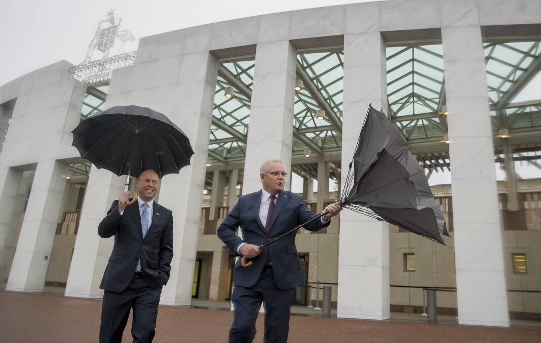 Prime Minister Scott Morrison faces rough winds outside Australian Parliament House, the morning after Treasurer Josh Frydenberg announced his second federal budget. Picture: Sitthixay Ditthavong