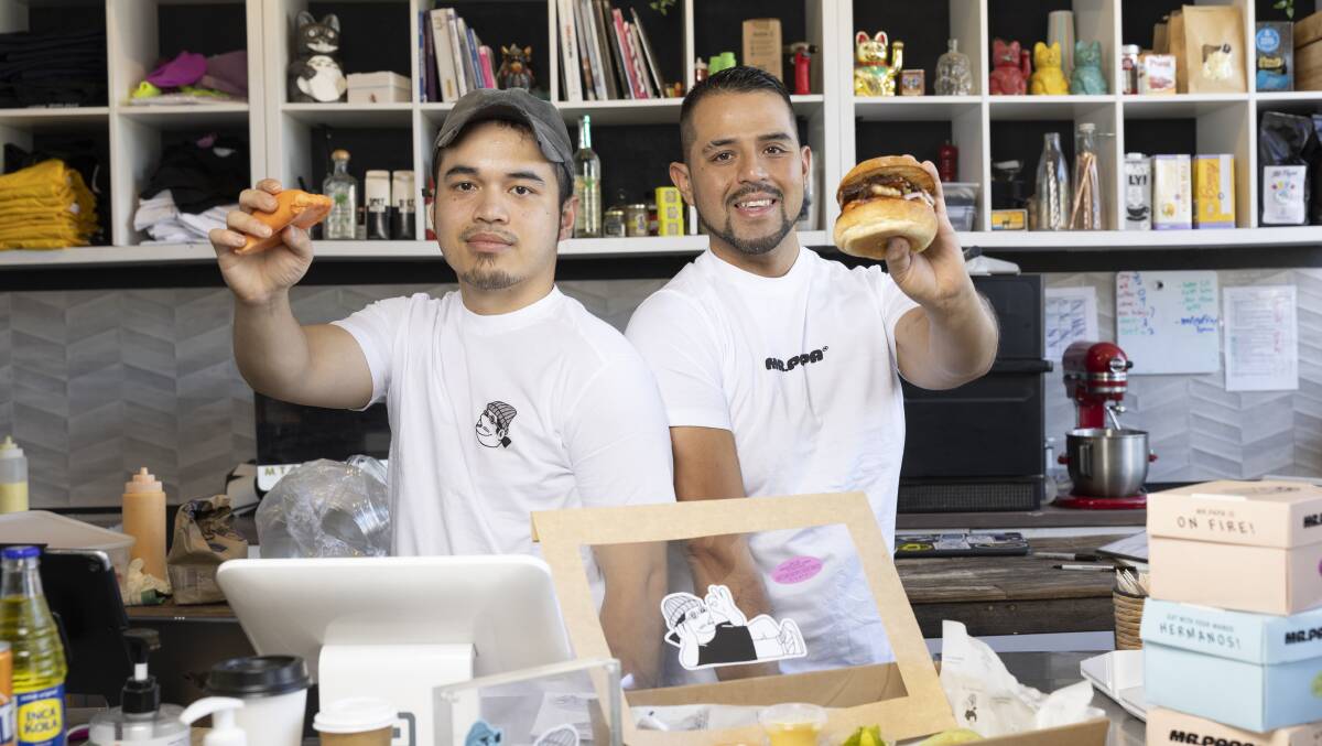 Dominic Kiamzon and Alonso Chiok, staff members from Mr Papa restuarant in Fyshwick. Picture by Keegan Carroll