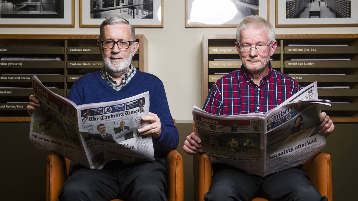 Volunteers John Warren and Neil Hamilton at the National Library of Australia updated the database on Trove of old newspapers in 2021. Picture by Dion Georgopoulos