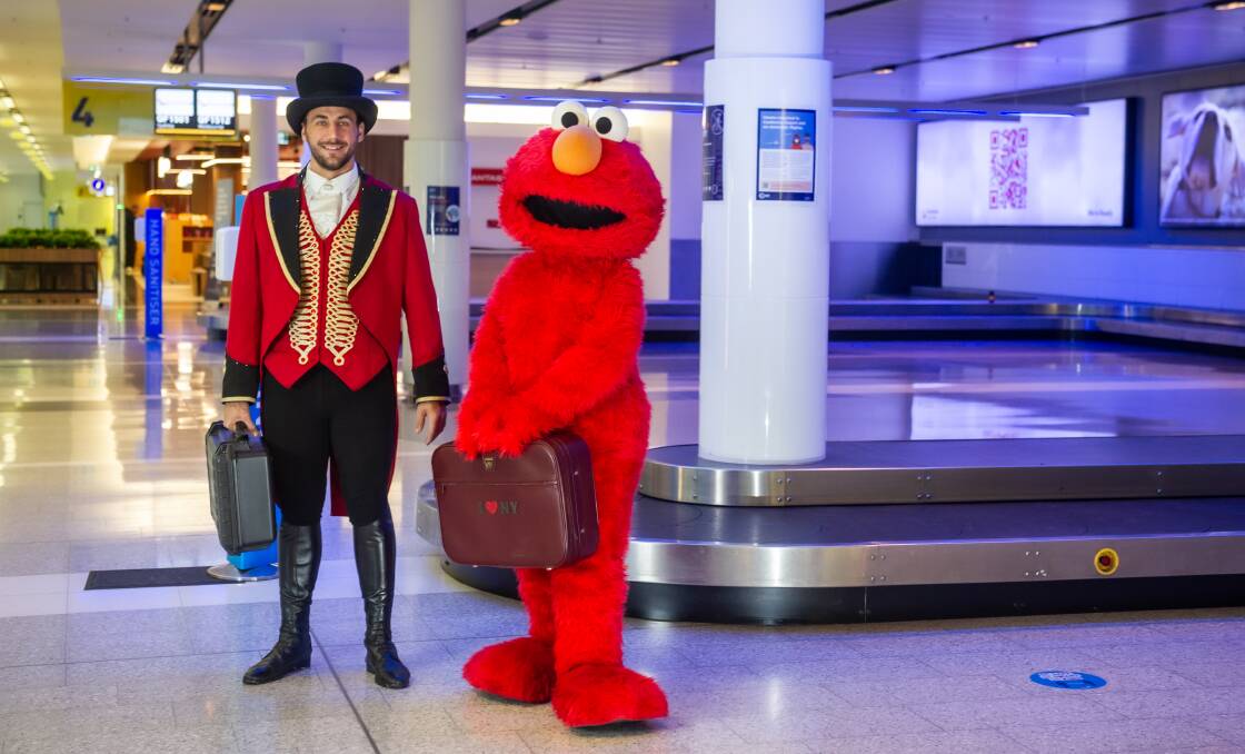 Elmo and ringmaster Michael Keen arrive at Canberra Airport. Picture: Karleen Minney