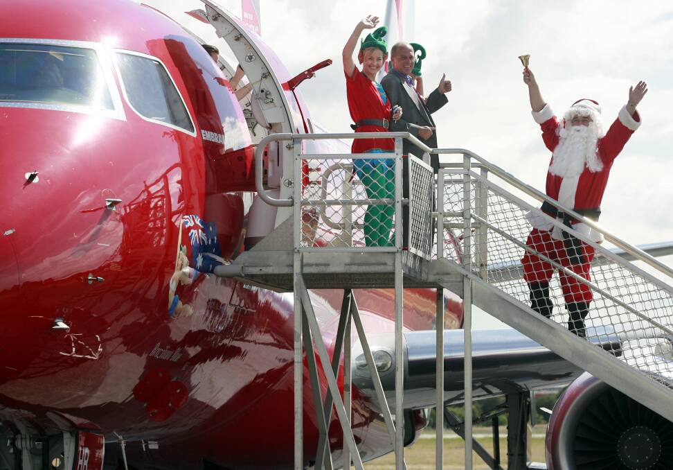 Flashback: Smiles all around as Virgin lands its first plane at Albury airport in November 2007.